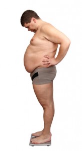 Übergewichter Mann auf der Waage [© Kokhanchikov - Fotolia.com]